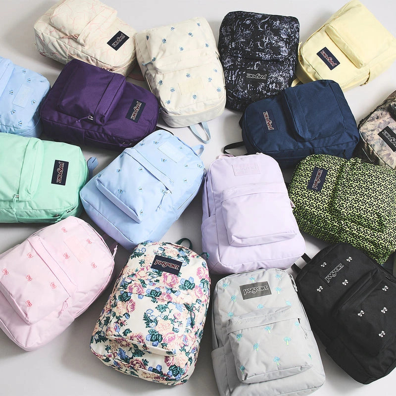 Colorful JanSport backpacks arranged together